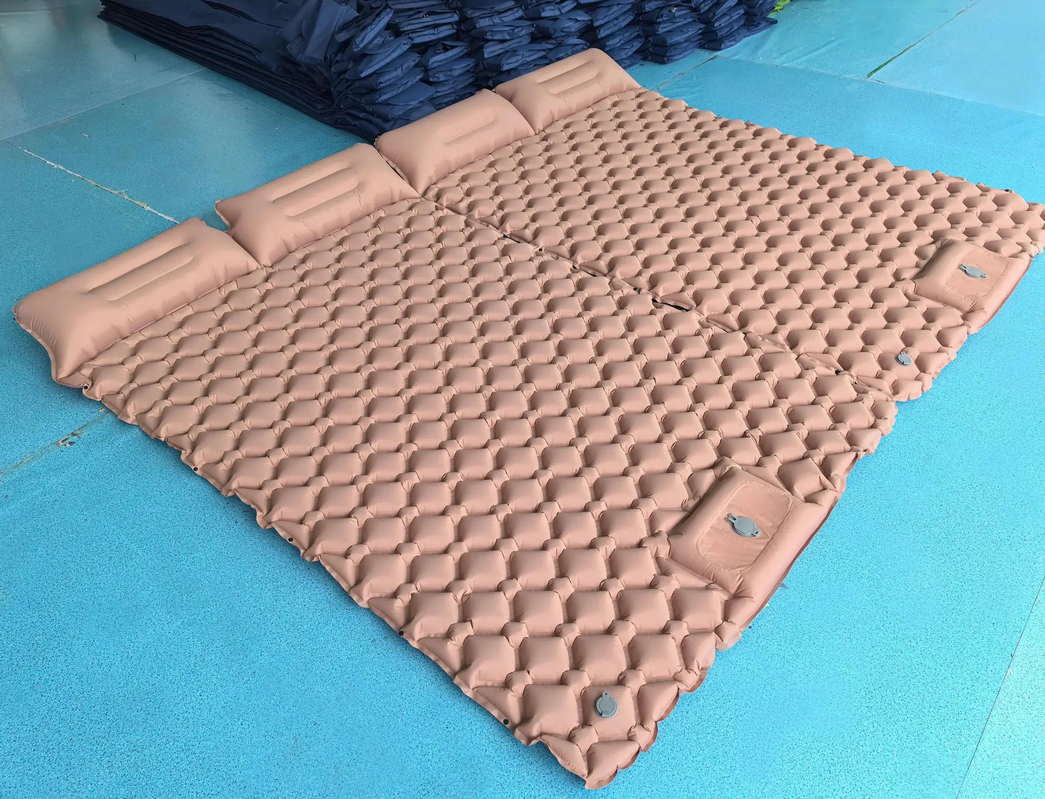 Beige double air mattress with built-in pump for camping and outdoor travel