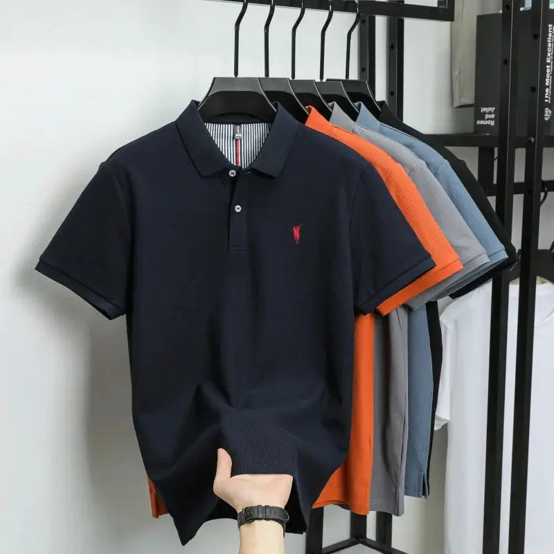 Navy polo shirt with red Paul Pony embroidery; 100% cotton, men's golf/business casual polo, multiple colors on rack