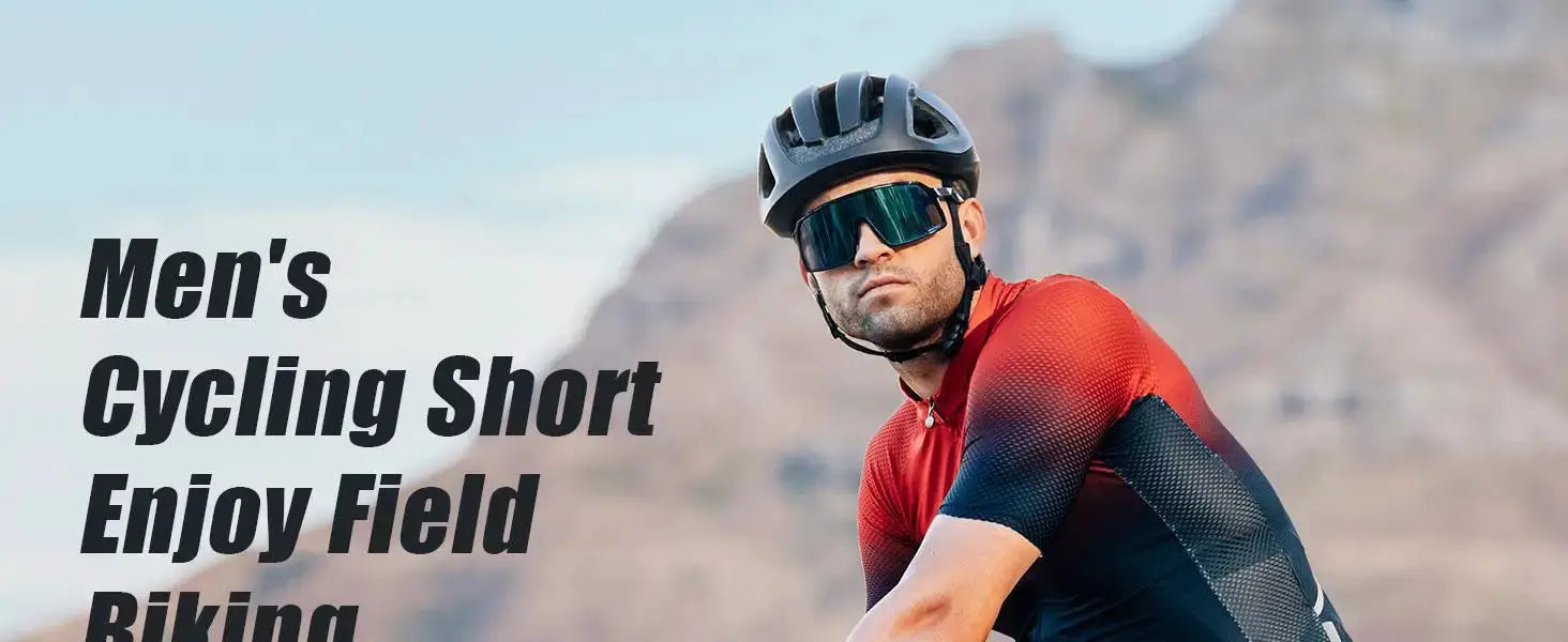 Male cyclist in a red-to-navy gradient cycling jersey, wearing helmet and sunglasses, outdoors with mountains