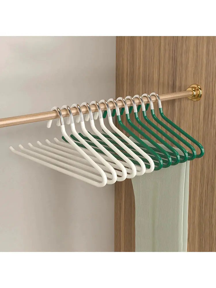 30pc goose-shaped pant hangers on a wooden wardrobe rod; white and green anti-slip plastic.