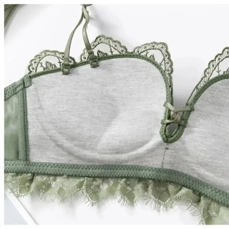 Lace bralette in green with scalloped edges and light gray cups, wireless