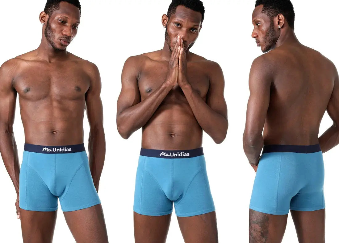 Cotton men's boxer shorts in sky blue with a navy waistband labeled MaUnidias; front and back views.