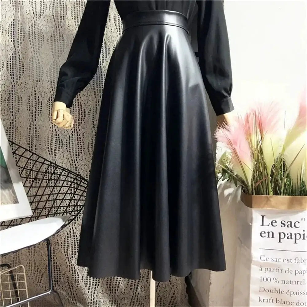Women's PU leather midi skirt, black, high-waist A-line flare for office or party.