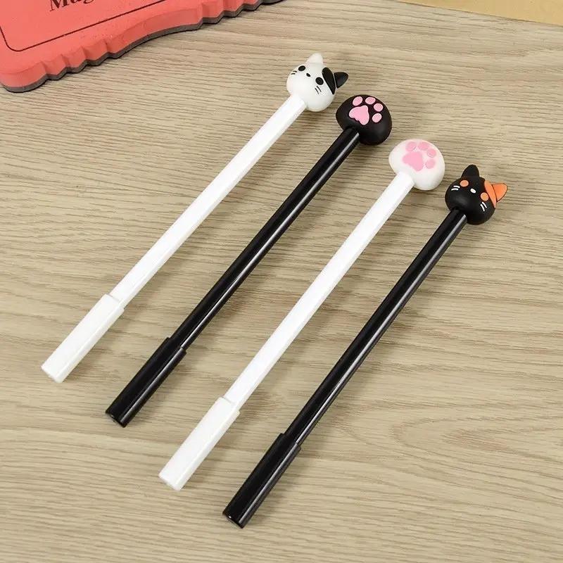 Four kawaii cat gel pens with cat-head and paw toppers, white and black bodies, black ink
