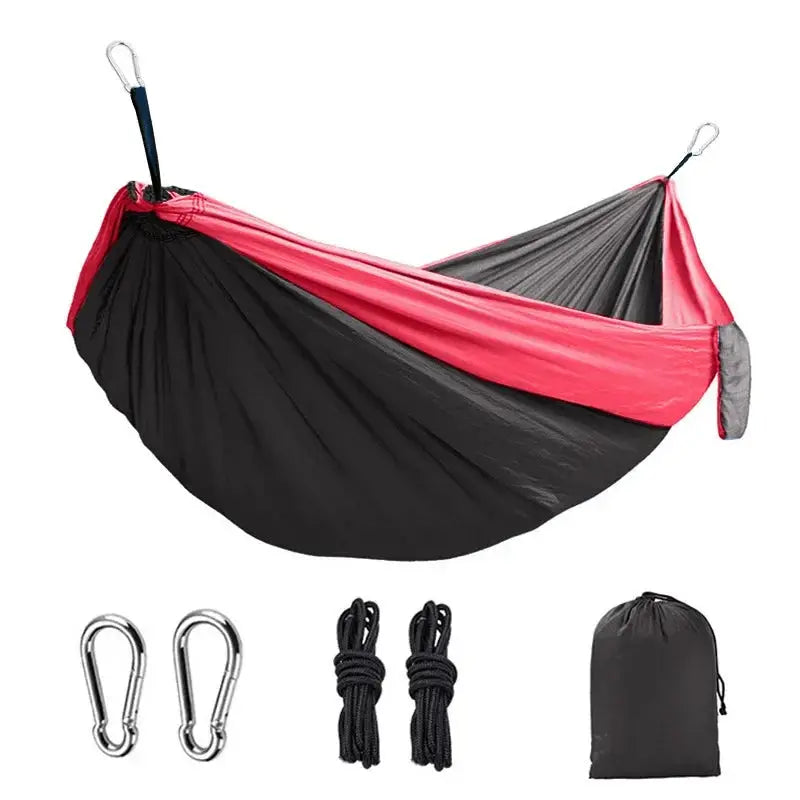 Outdoor single camping hammock by Simples Market in red/black nylon parachute fabric with 2 carabiners and 2 cords