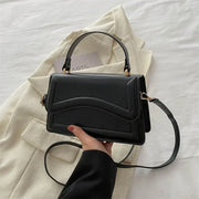 PU leather handbag by Simples Market, black small crossbody with top handle