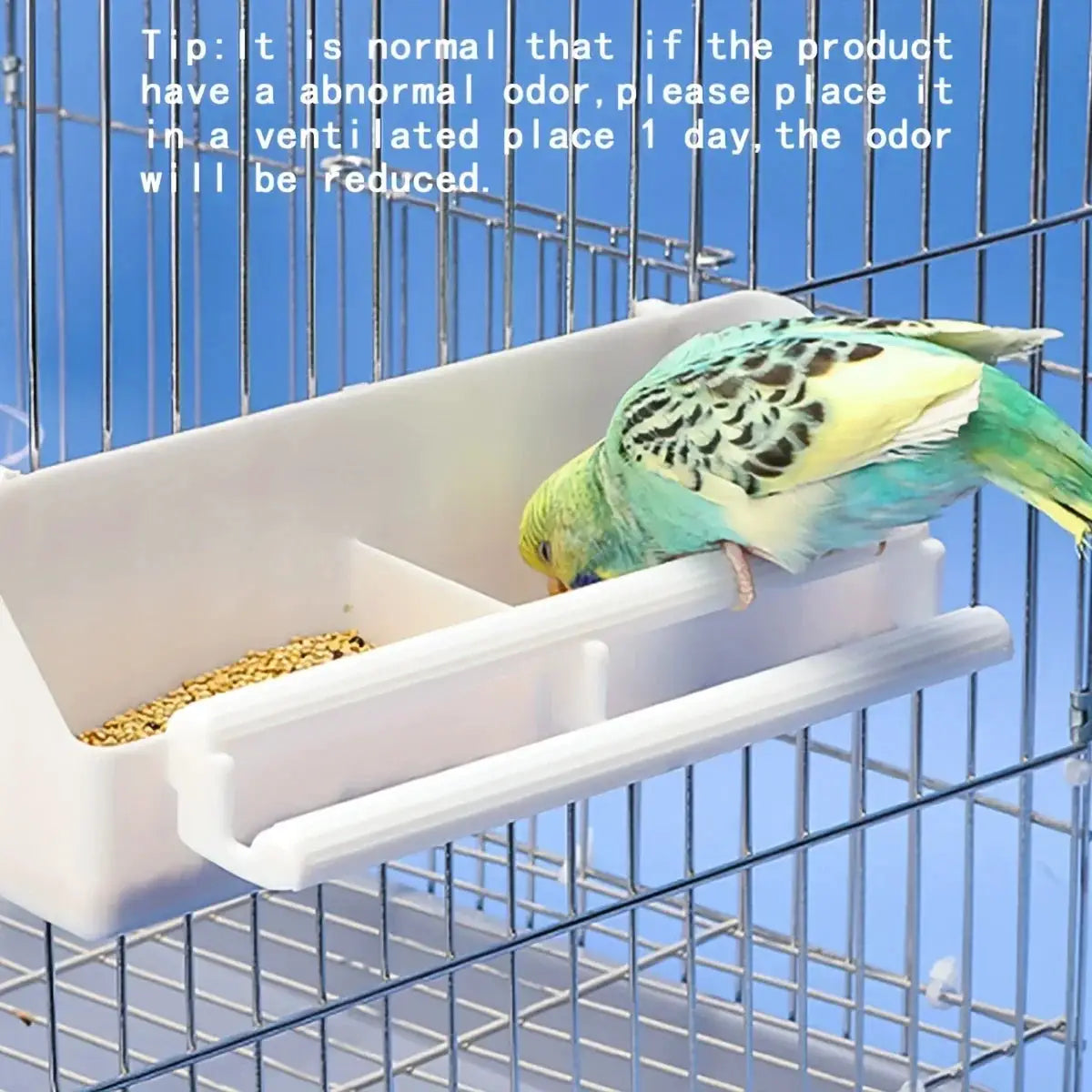 Parrot feeding trough by Simples Market, white plastic double-grid stand with seeds in a cage.