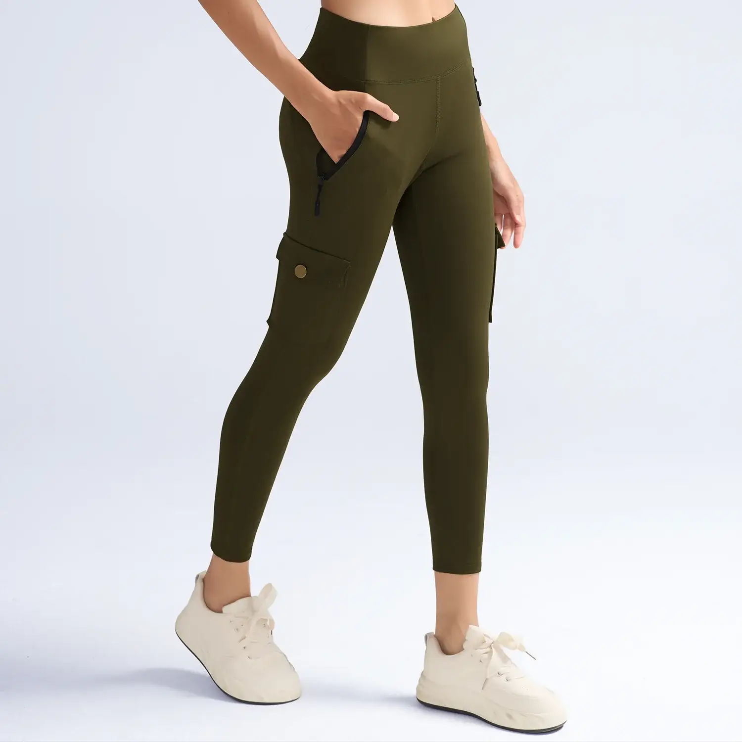 Simples Market olive green women's cargo-pocket leggings with high waist, hip zip and thigh pockets.