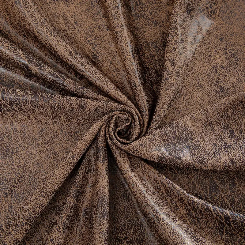 Stretch sofa cover in brown speckled fabric with elastic material for living room protection
