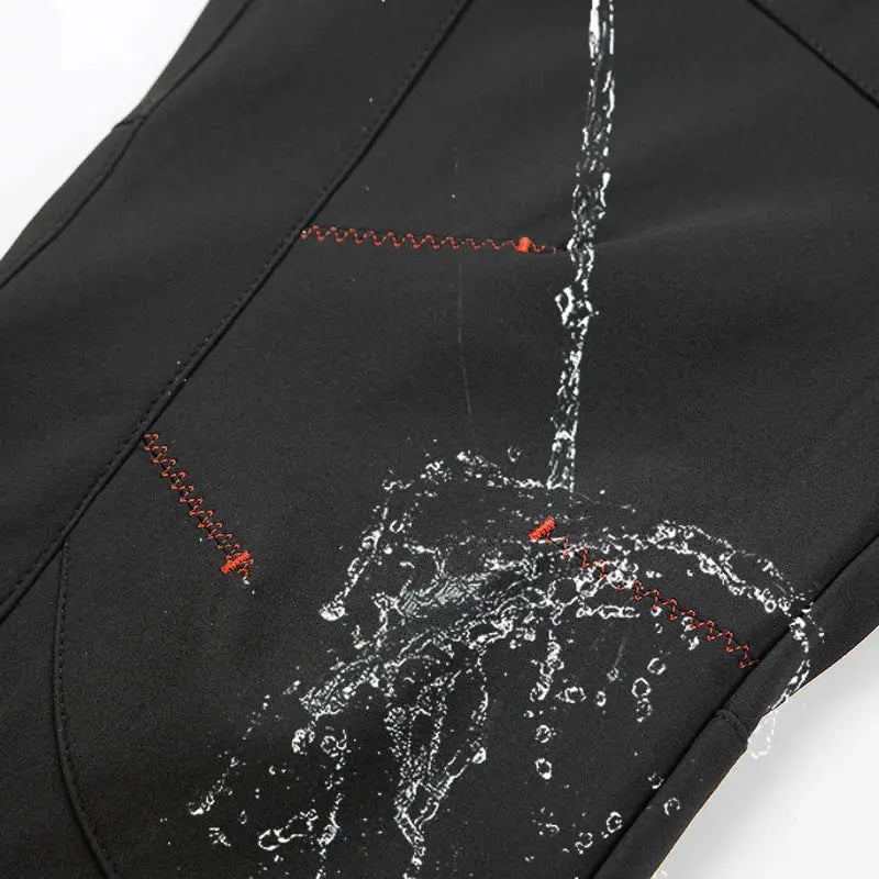 JNLN men's black soft-shell hiking pants with red contrast stitching and water splash graphic