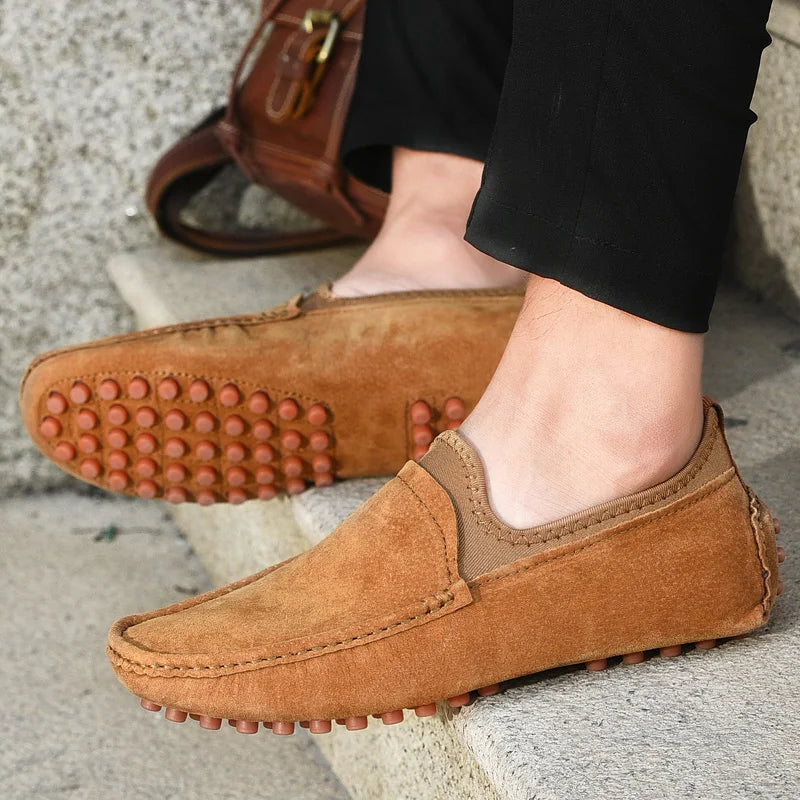 Men's brown suede driving loafers with a rubber nub sole for casual outdoor wear