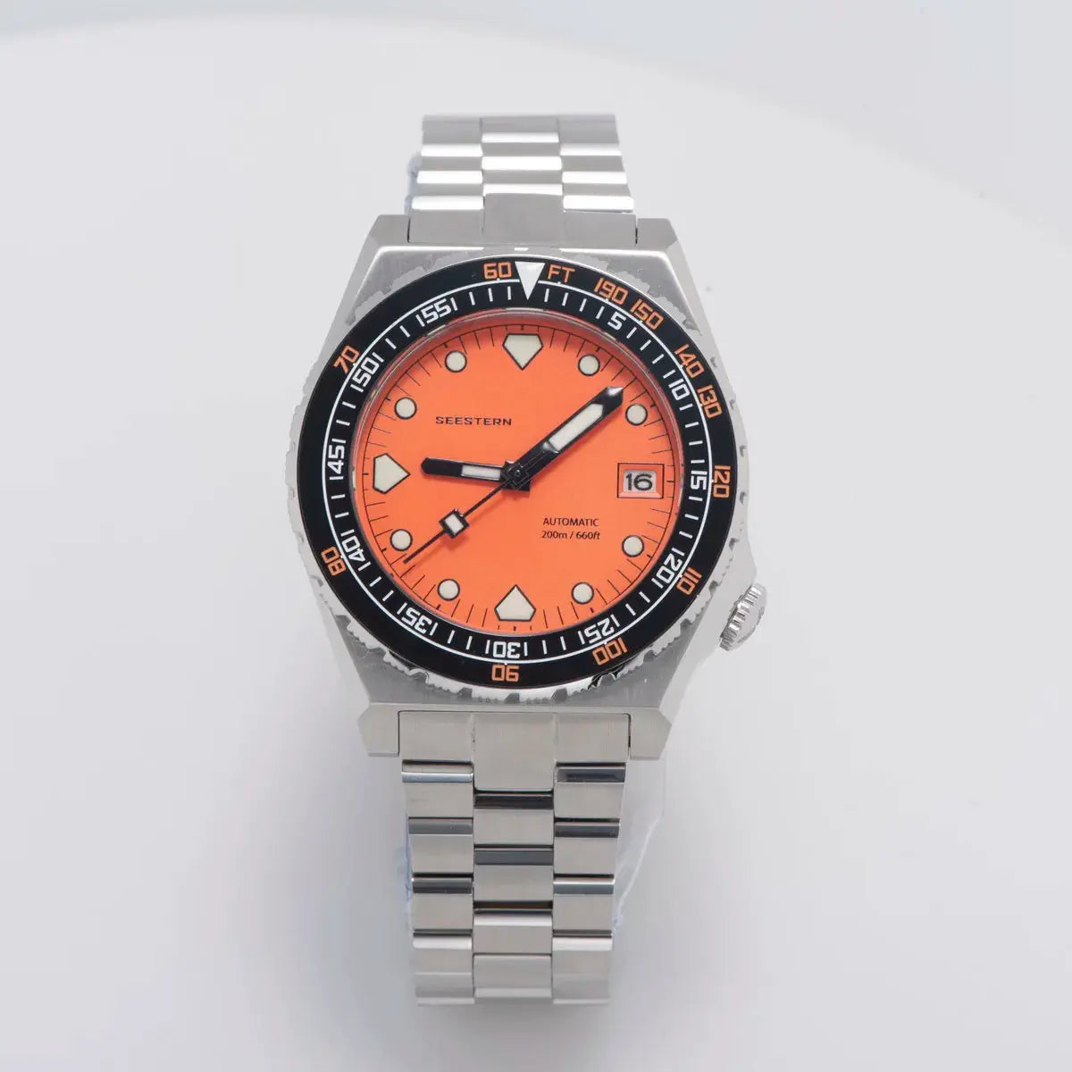 Seestern SUB600T orange-dial diver watch with ceramic bezel and stainless steel bracelet.