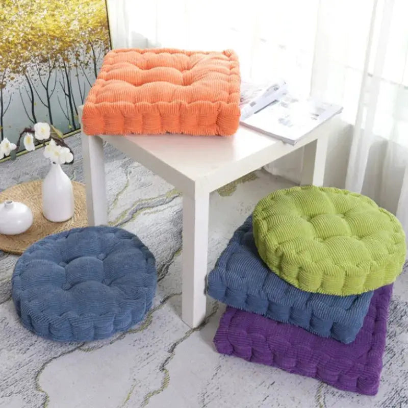 Set of four tufted square seat cushions in orange, blue, lime green, and purple (50x50cm) for home, office, and patio.
