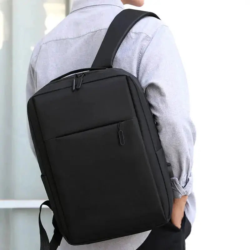 Versatile waterproof business laptop backpack worn by a person, showcasing its sleek design and ample storage.