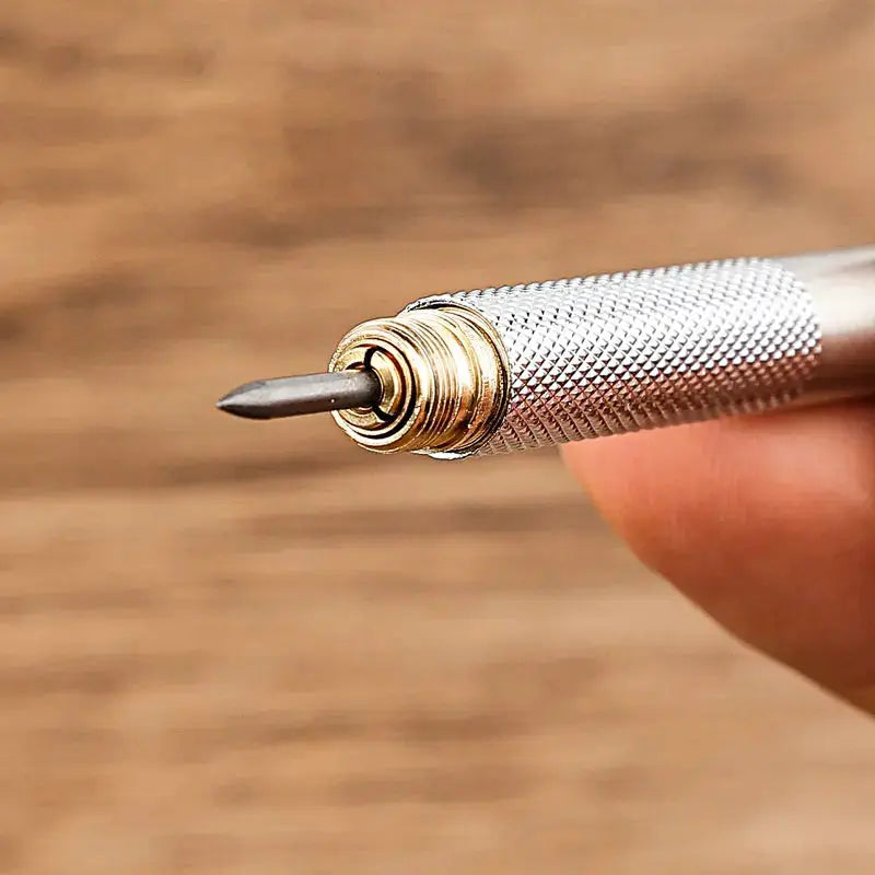 Mechanical pencil tip with knurled silver metal body and exposed lead