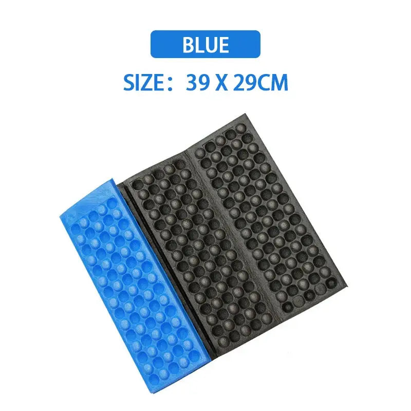 Camping foam pad blue and black with textured dotted surface, 39 x 29 cm