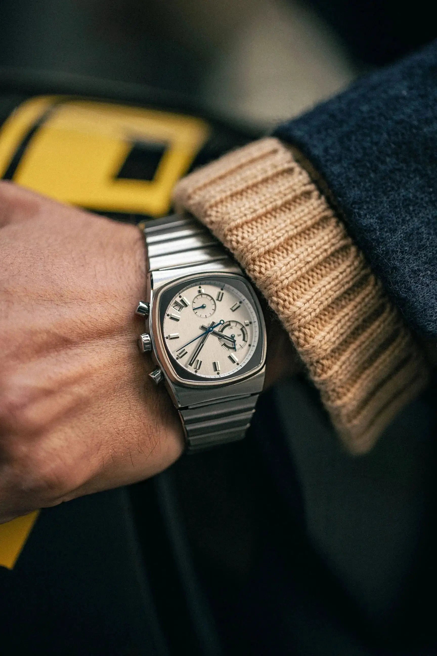 CILOA men's stainless steel watch with white dial and chronograph subdials on a metal bracelet.
