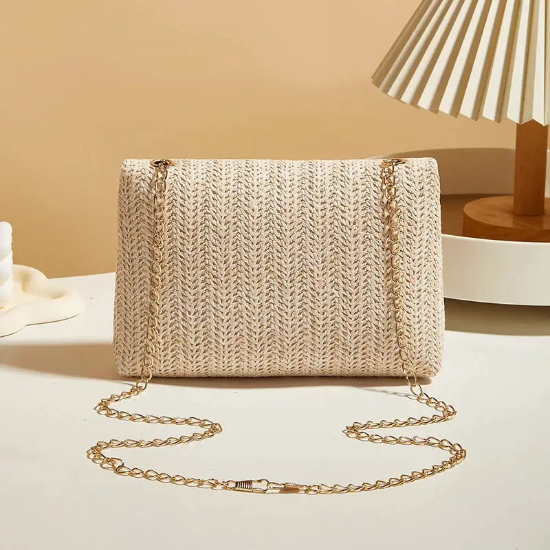Crossbody bag for women by Simples Market, beige woven straw with gold-tone chain strap