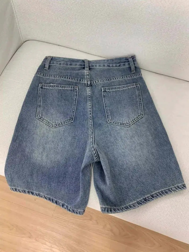 Women's denim shorts, blue knee-length high-waist wide-leg with two back pockets.