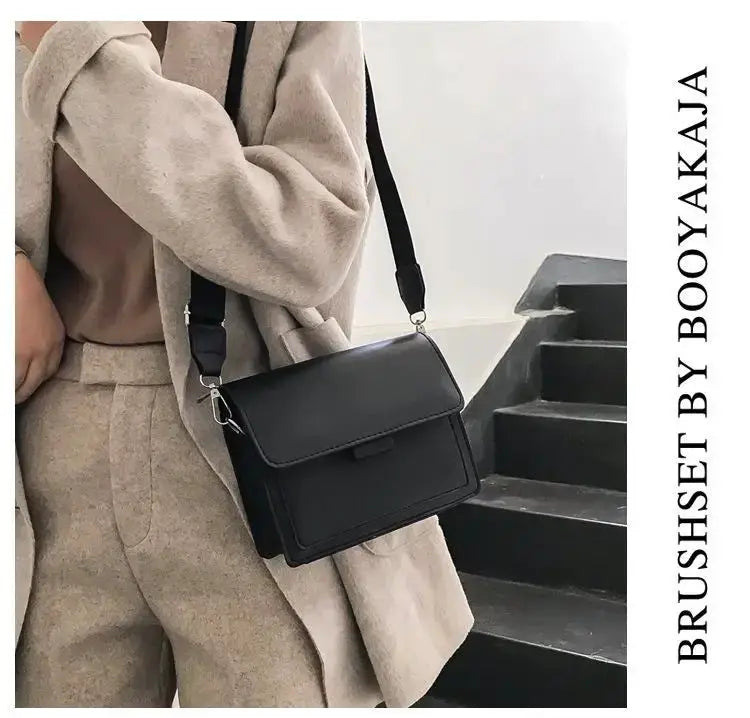 Simples Market classic designer PU leather crossbody bag, black with front flap and adjustable shoulder strap