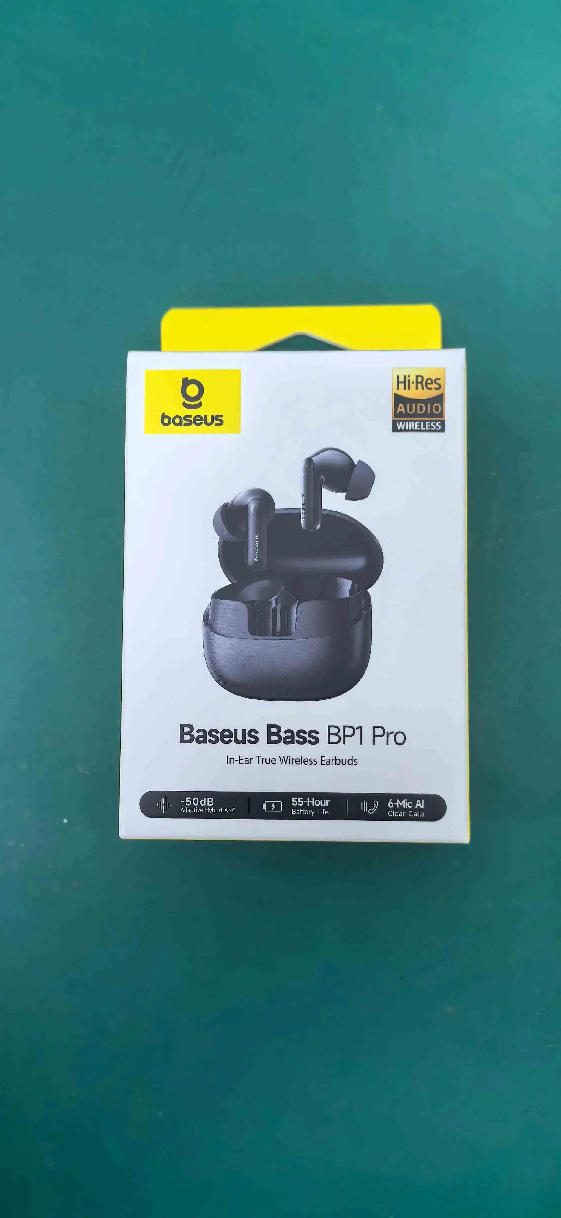 Baseus Bass BP1 Pro earbuds in black with charging case; Baseus logo and Hi-Res Audio badge on the box.
