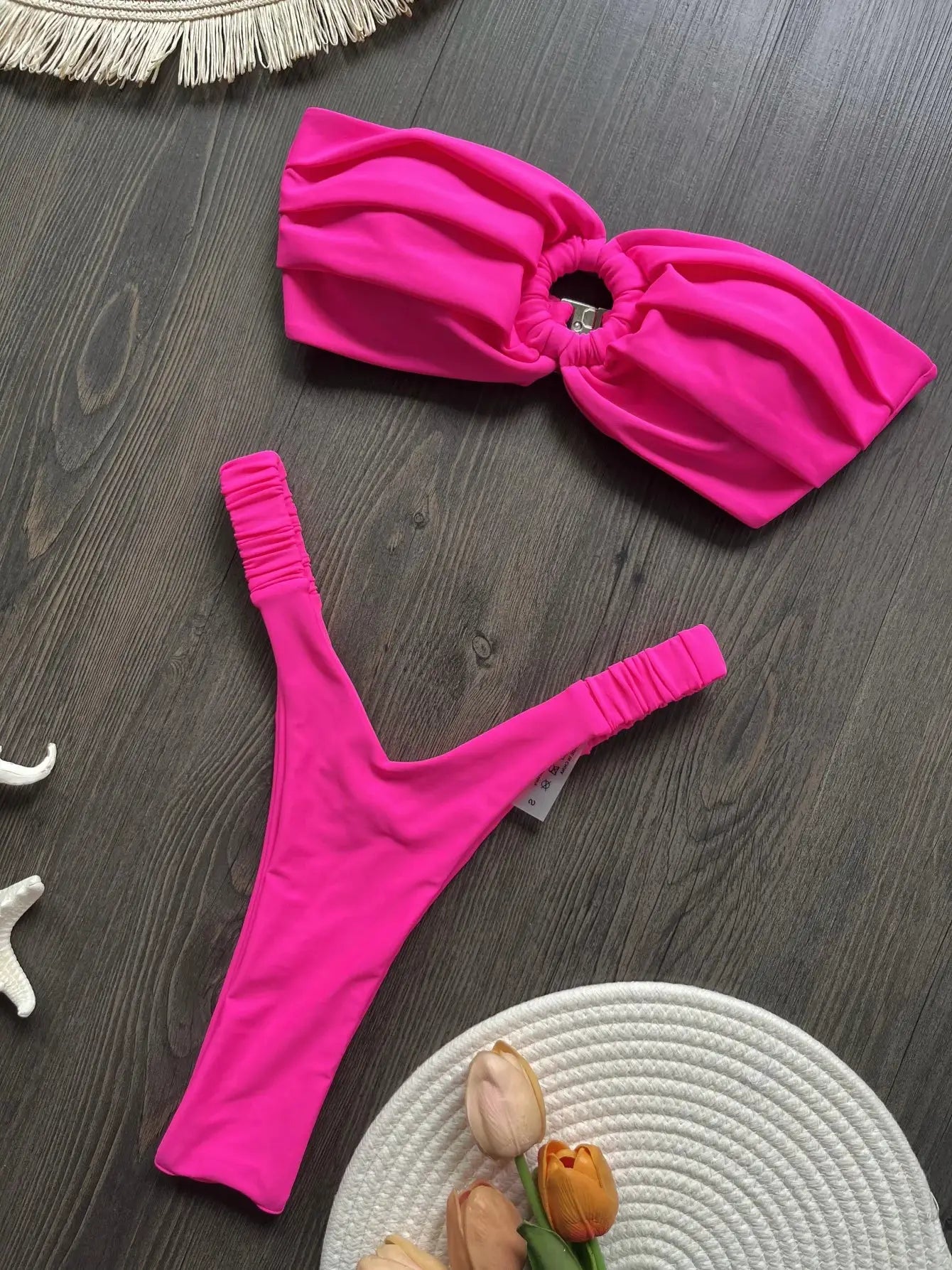 2-piece pink micro bikini set with bandeau top and high-cut bottoms; vivid fuchsia.