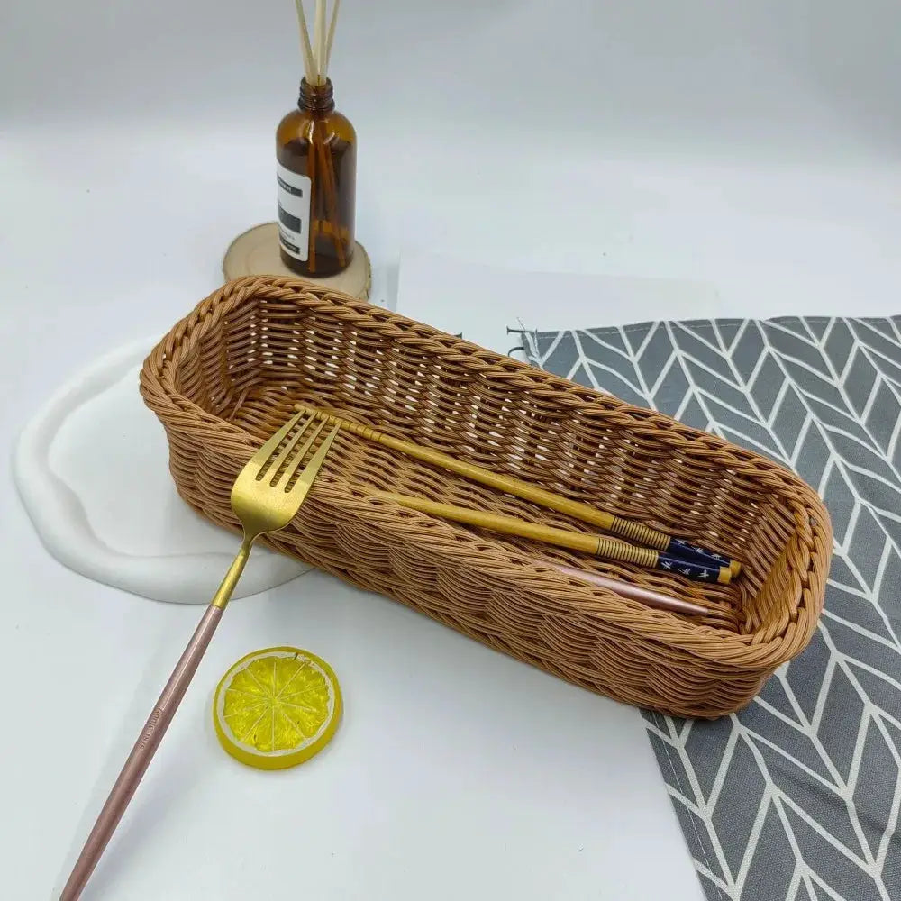 Simples Market imitation rattan storage basket, brown faux wicker on a white desk with a gold-toned fork