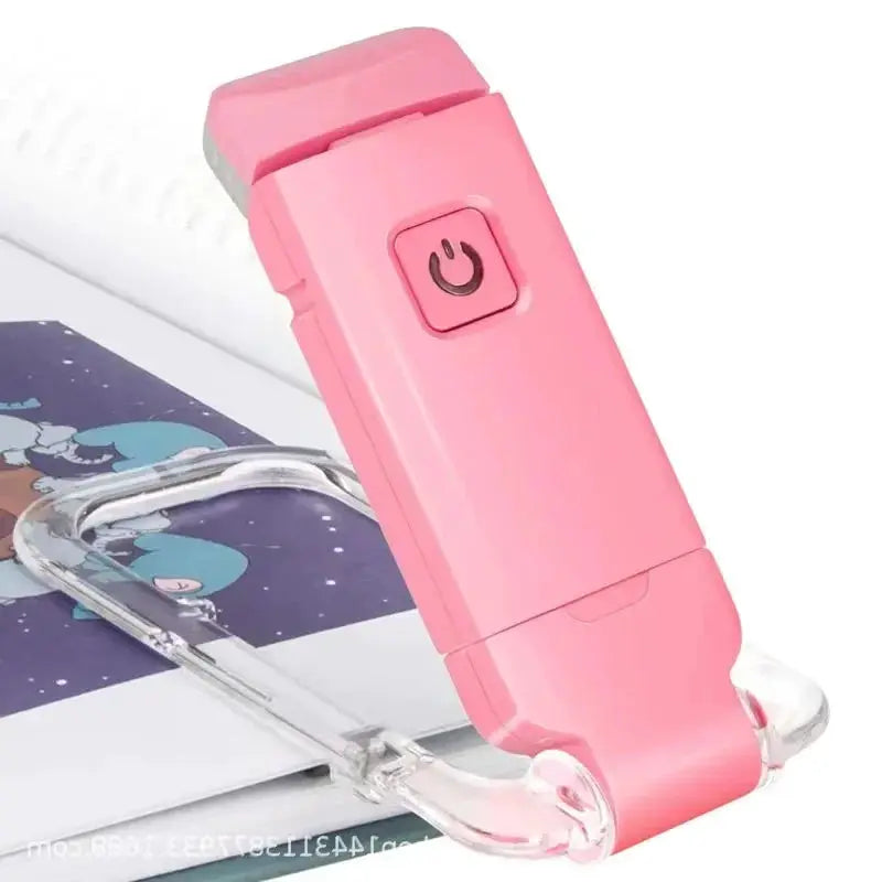 Pink LED USB rechargeable book light with a clip-on flexible arm.
