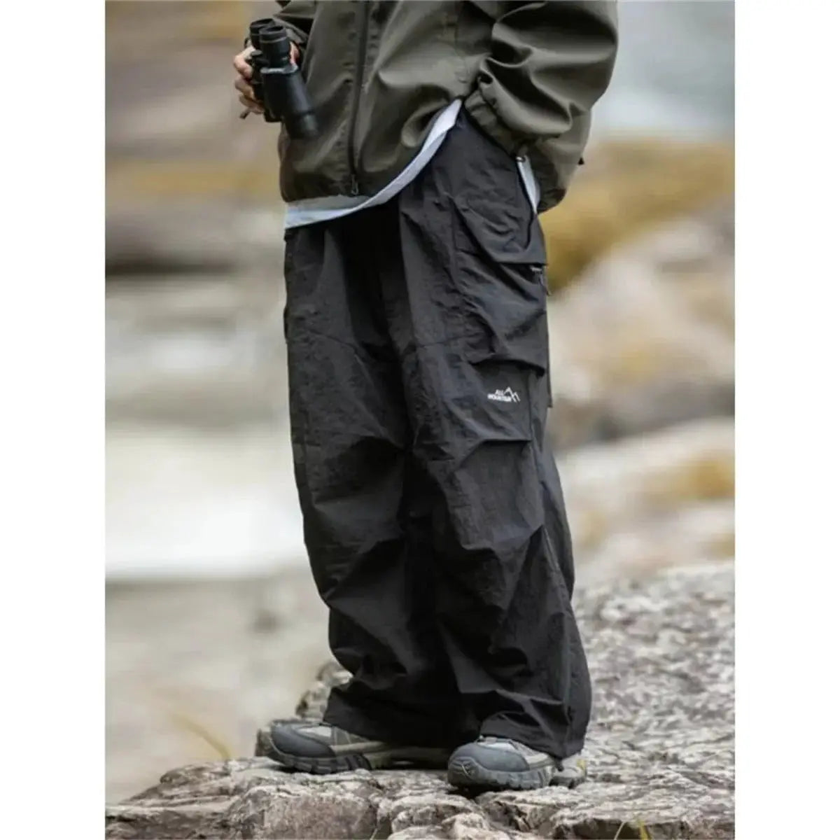 Men's black waterproof cargo hiking pants by Simples Market with multiple pockets