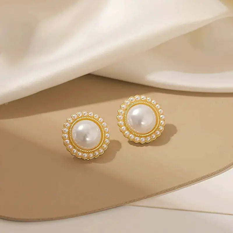 Simples Market gold-tone pearl stud earrings with a halo of tiny white pearls
