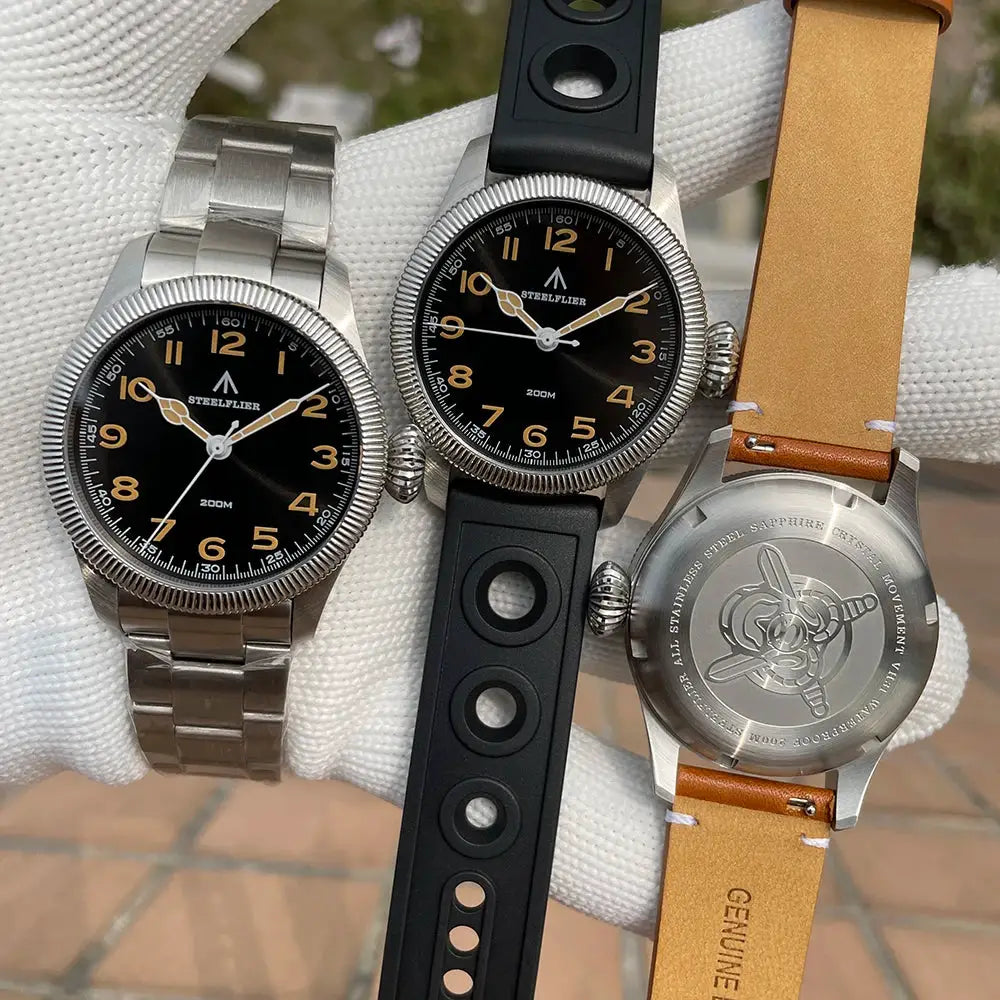 STEELFLIER SF741 watches - three with black dials; stainless steel bracelet, rubber and leather straps