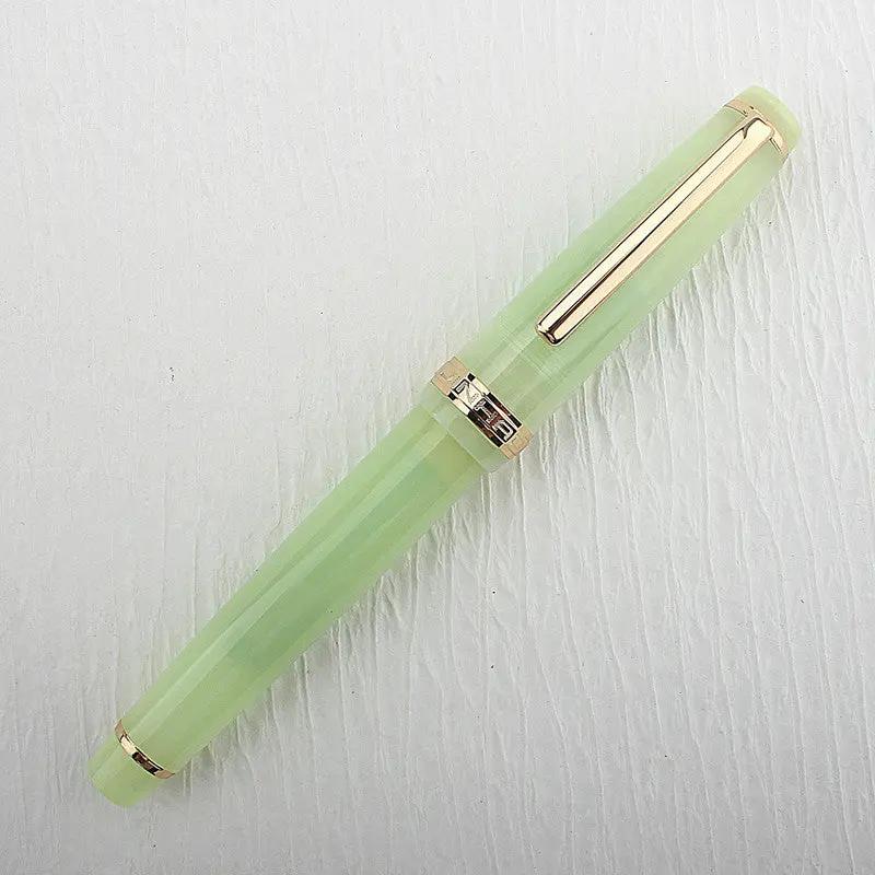 Jinhao 82 fountain pen, light green translucent acrylic with gold trim, cap band and clip, converter included