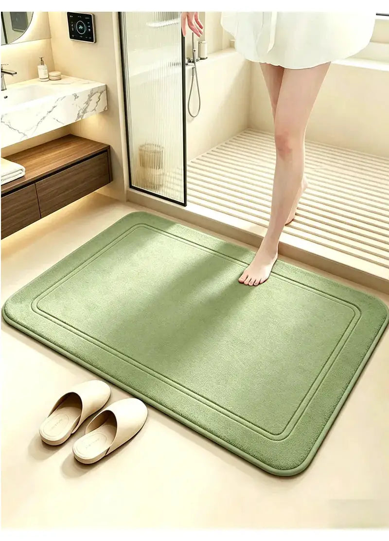 Green bathroom rug with non-slip shower mat, quick-dry and high water absorption for home bathrooms.