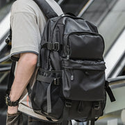 ZUOKEDISI 15.6-inch laptop travel backpack by Simples Market, black with multiple zip pockets and mesh side pocket