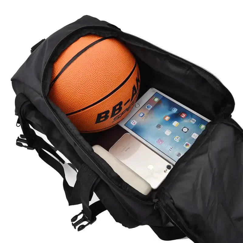 Black waterproof gym bag open with basketball, tablet and smartphone inside; ultralight large sport backpack.