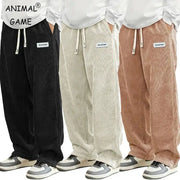 Men's corduroy casual pants in four colors black beige cream brown; elastic drawstring waist, loose-fit baggy straight.