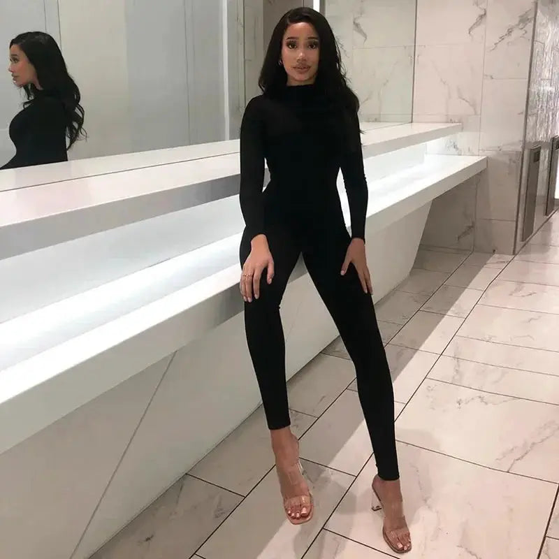 Simples Market solid black long-sleeve women's jumpsuit, slim-fit full-length sportswear.