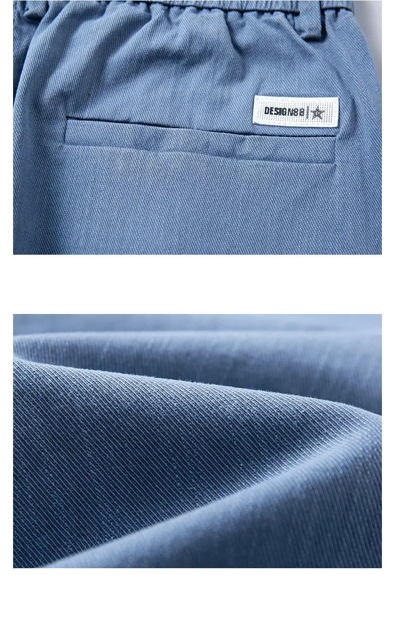 Men's blue cotton twill pants with elastic waist and back welt pocket.