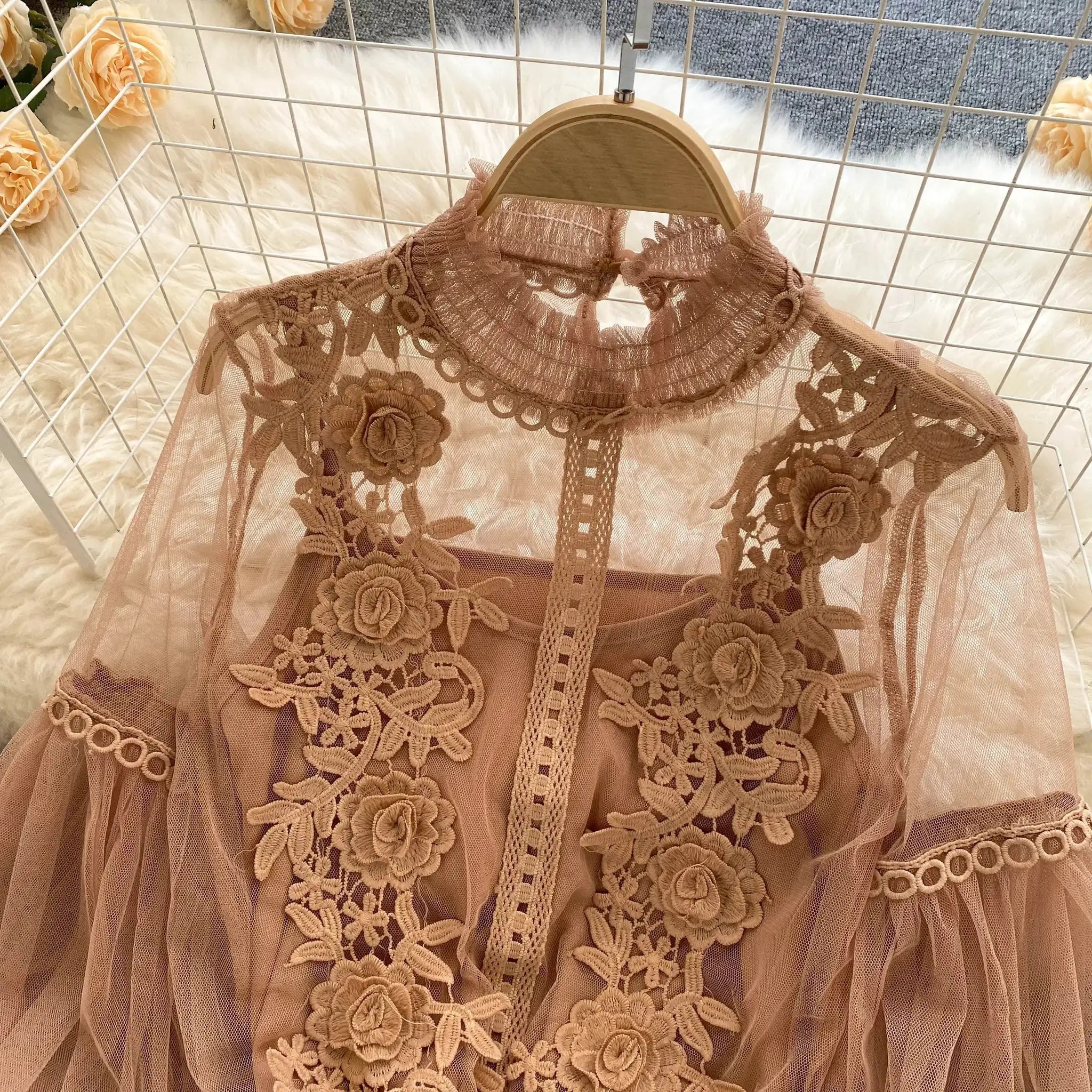 Lace puff long-sleeve blouse in rose beige with floral embroidery and high-neck lace design.