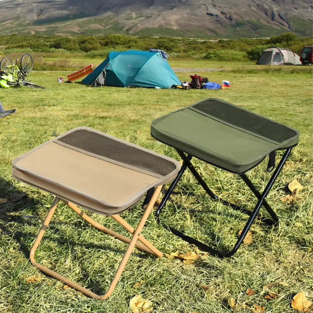 Folding camping stool pair; tan and olive green seats with metal frames for outdoor use