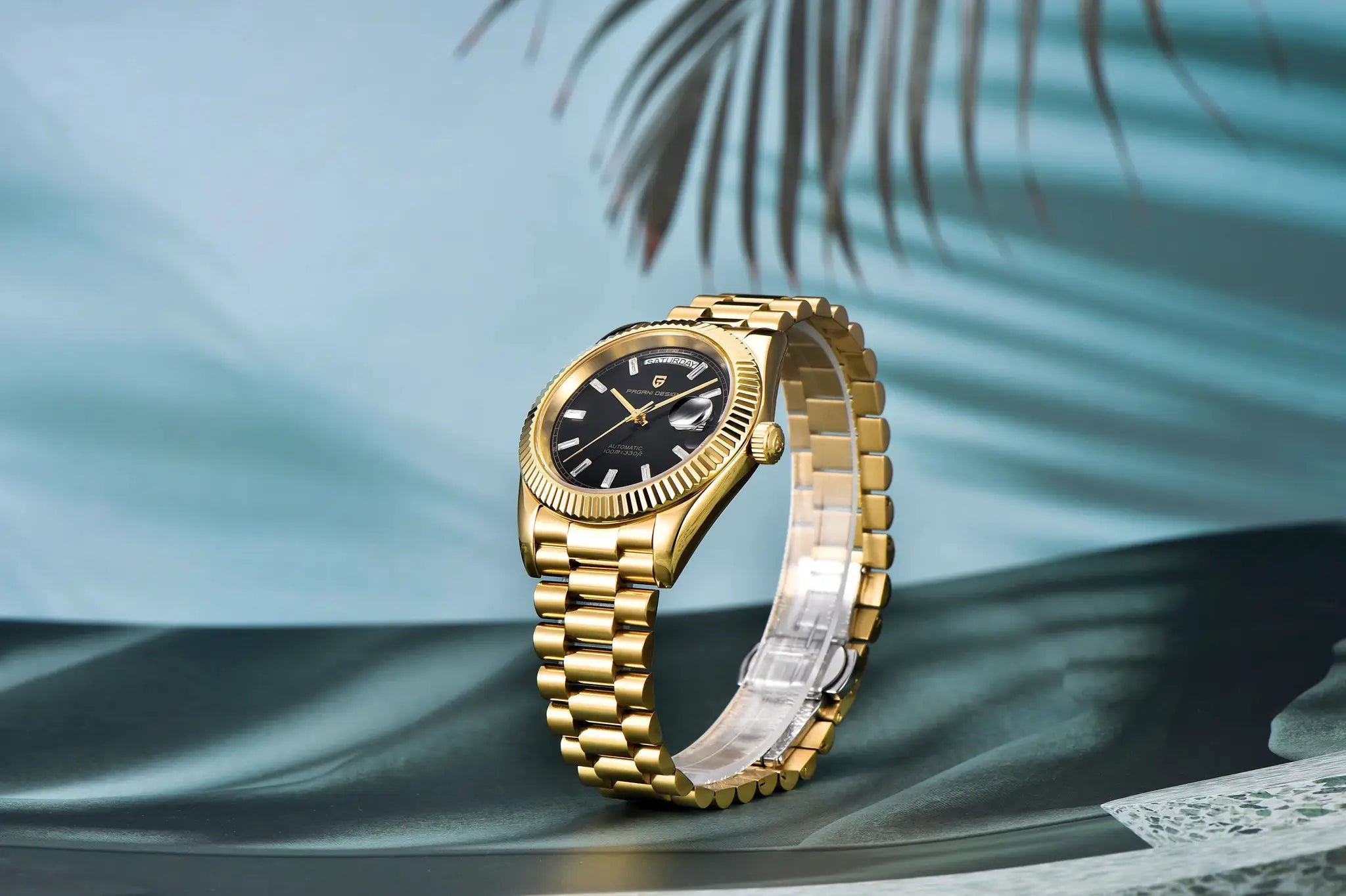 PAGANI DESIGN DD40 gold men's watch with black dial, date window and gold bracelet.