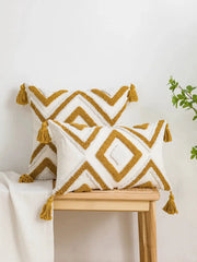 2 white cotton pillow covers with yellow geometric diamond line pattern and tassel trim, boho style