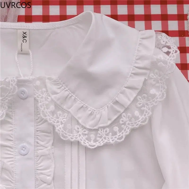 Lolita shirt white lace-trimmed Peter Pan collar blouse with ruffle front and long sleeves by Simples Market