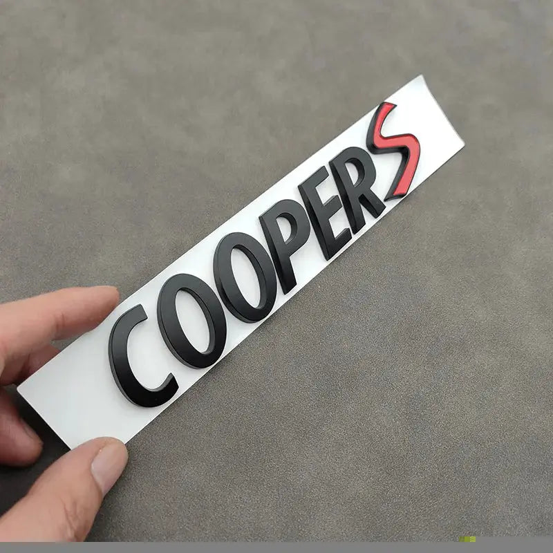 3D metal COOPERS S car front grille badge sticker, black raised letters on white backing with red S emblem