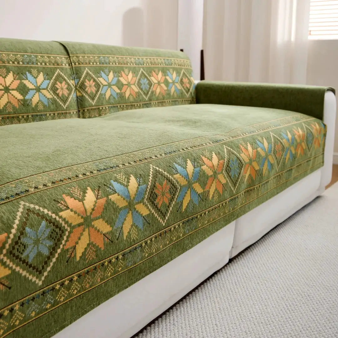 Bohemian jacquard chenille sofa cover by Simples Market; green with geometric patterns