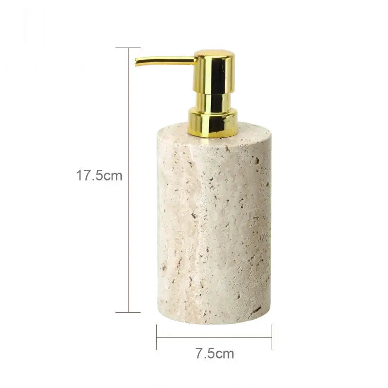 Soap dispenser by Simples Market in beige travertine with gold pump, 17.5cm tall and 7.5cm wide.