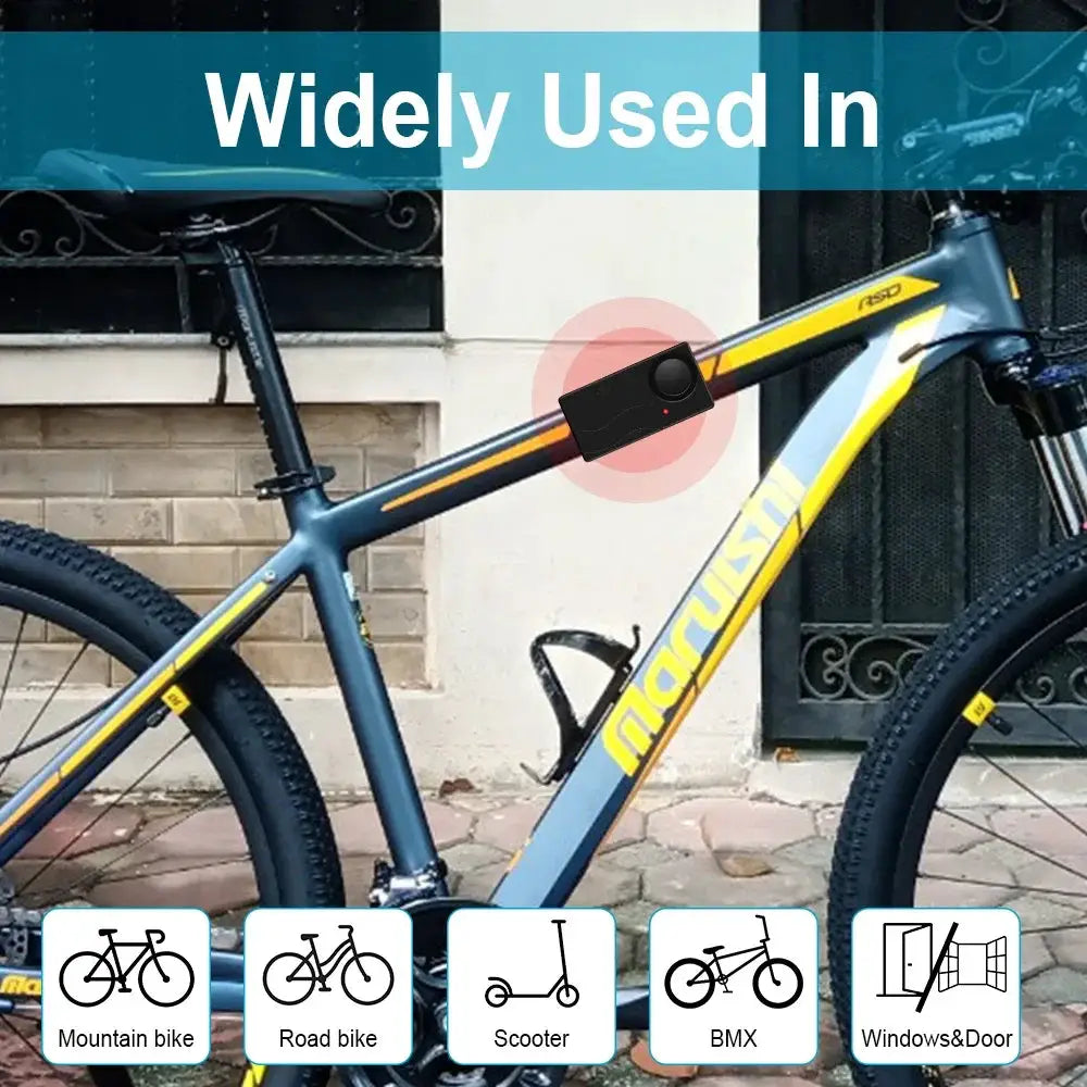 Anchtek 110dB wireless vibration alarm with remote for bikes on a blue-yellow mountain bike