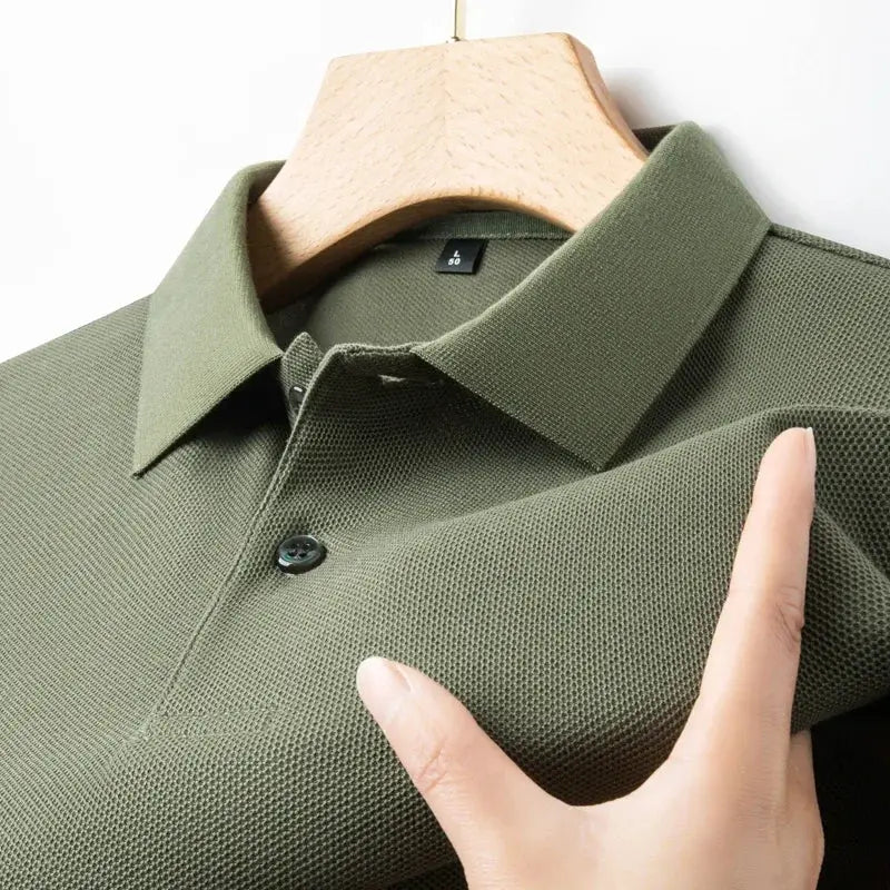 Men's olive green 100% cotton polo shirt on a hanger with collar and button placket