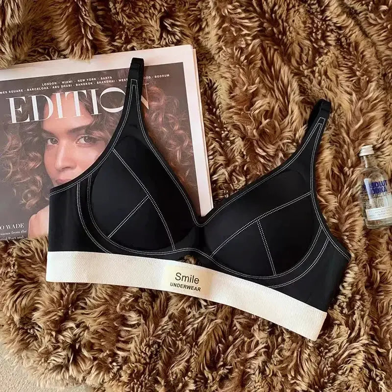 SP&CITY black seamless wireless bra with white underband labeled Smile Underwear