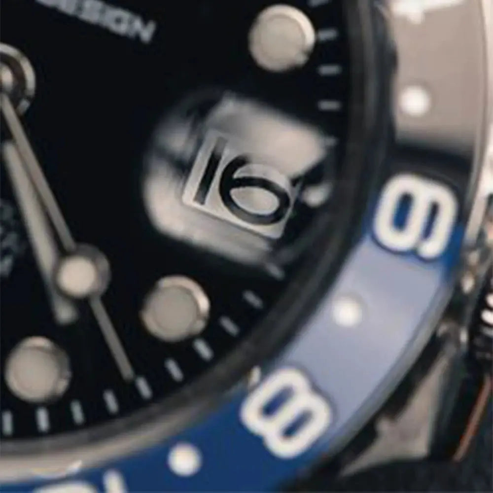 Pagani Design stainless steel GMT men's watch with sapphire glass, black dial, blue bezel, and magnified date window